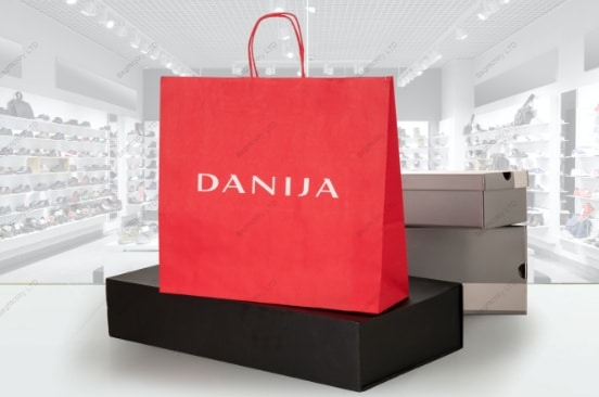 White Twisted Handle Paper Bags in size: 32 cm width x 17 cm depth x 41 cm height produced in Europe.